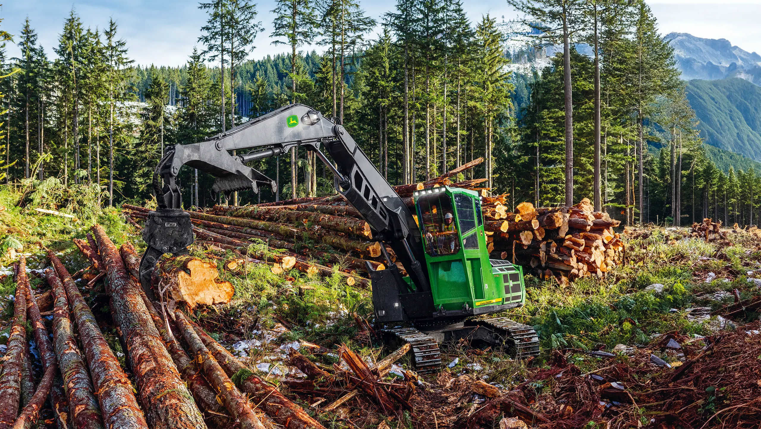John Deere log loader in mountain forest