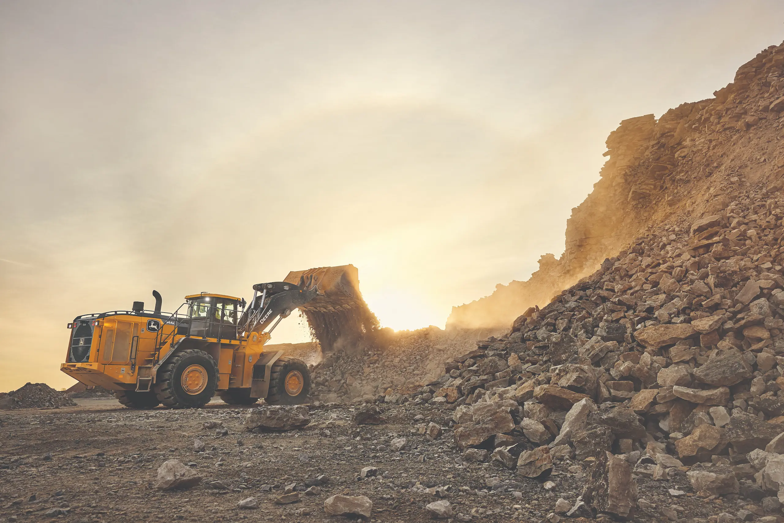 John Deere loader moving rock quarry