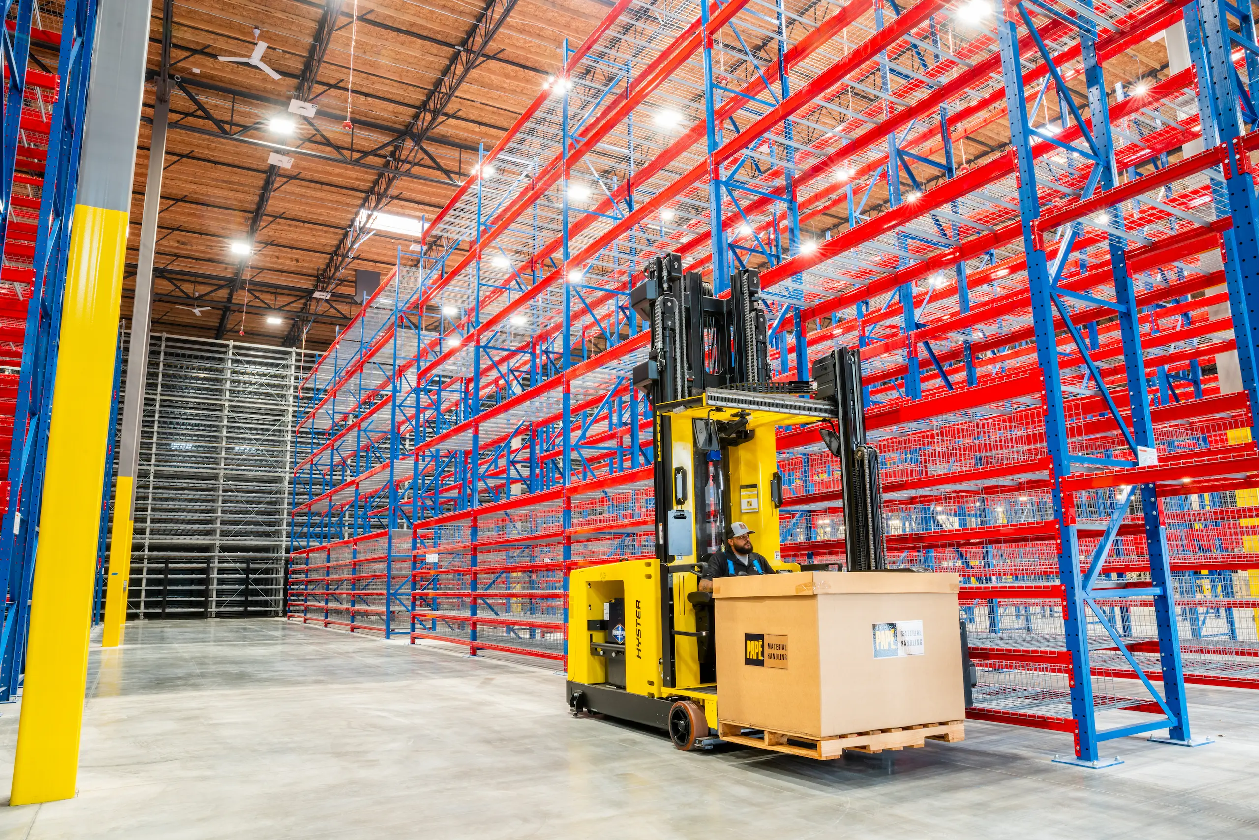 Hyster forklift lifting box in warehouse