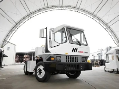 White yard truck under arched canopy