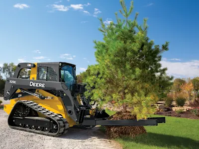 Skid steer transplanting tree with attachment