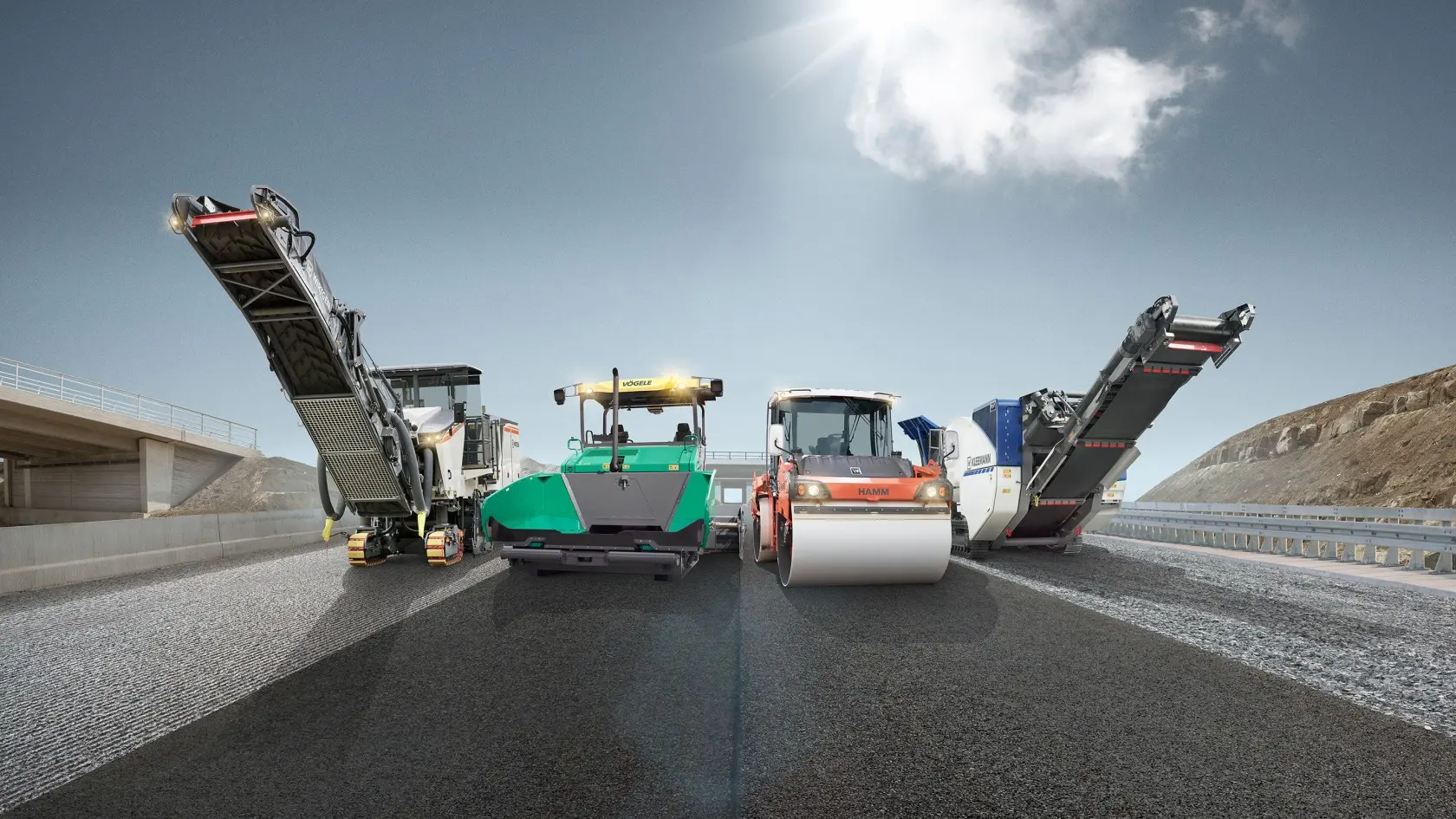 Four paving machines lined up on road