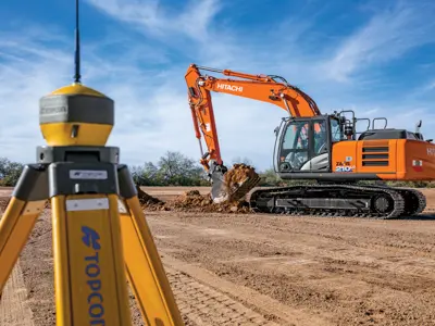 Survey device with excavator digging dirt