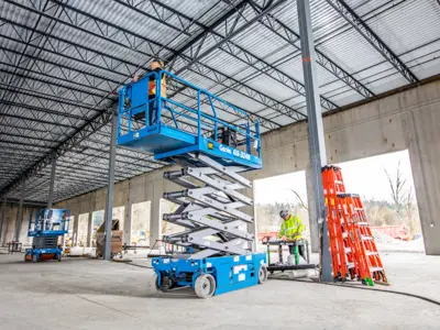 Scissor lift raised inside building structure
