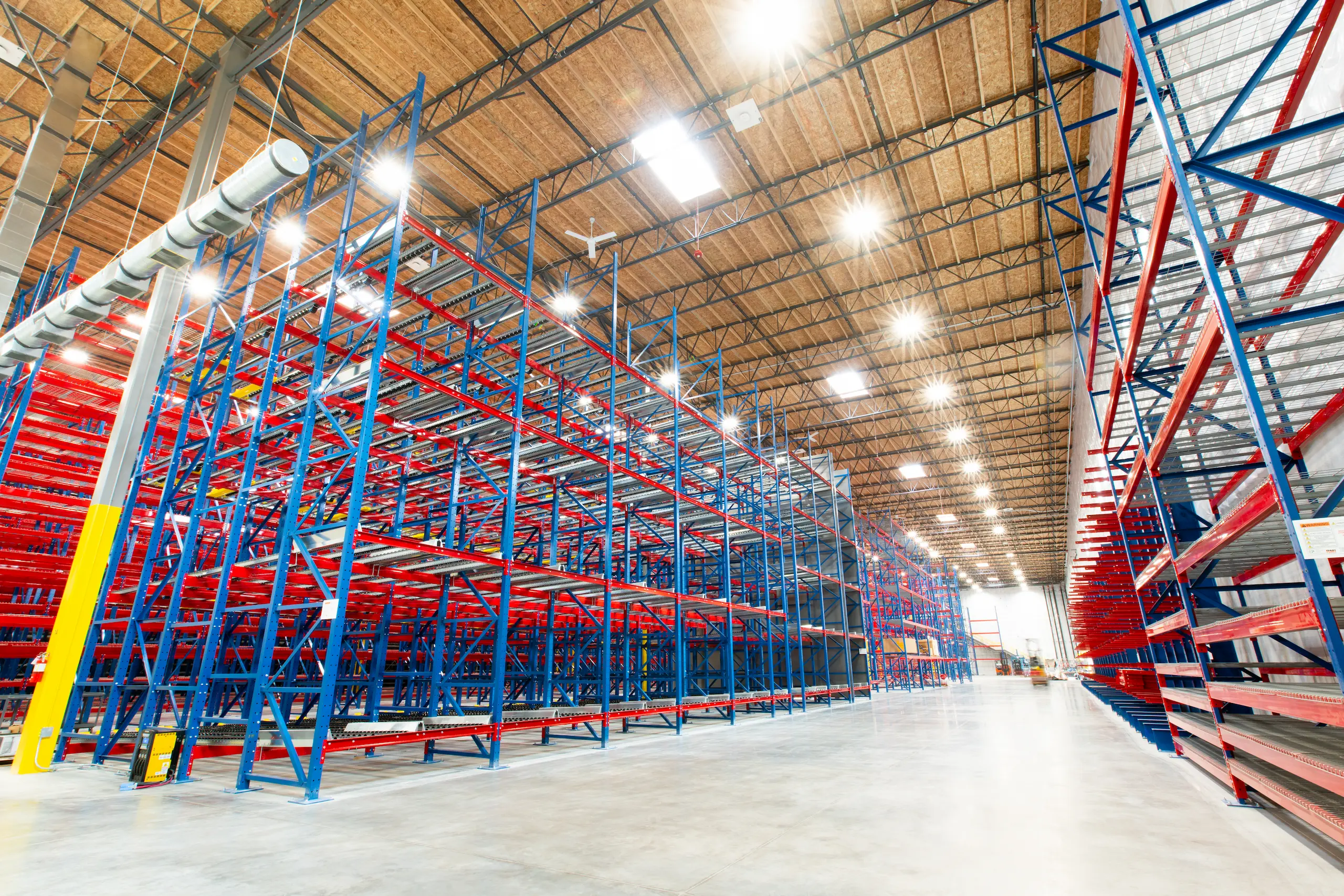 Empty warehouse with tall storage racks