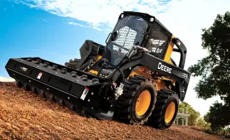 John Deere skid steer with attachment